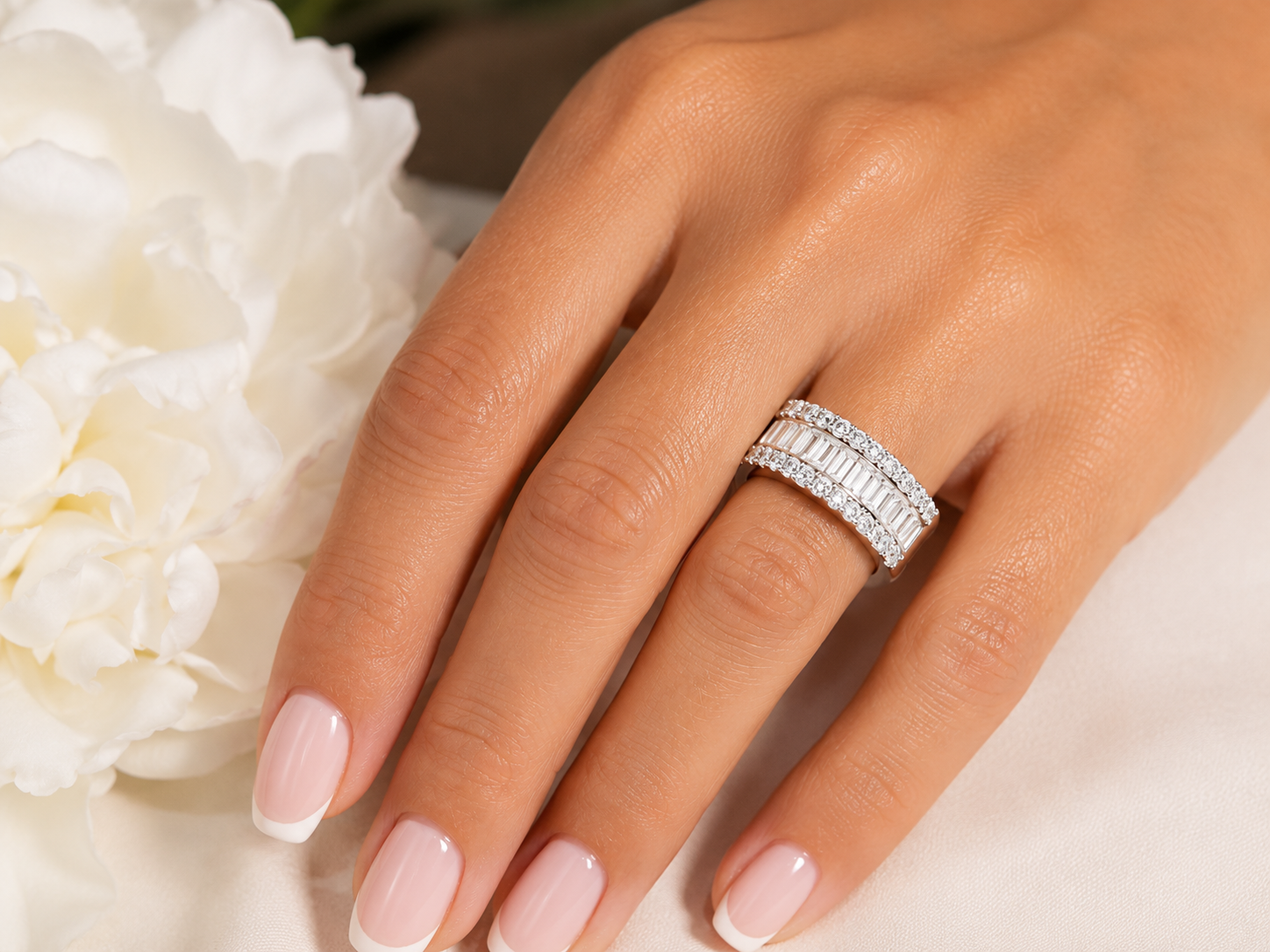 The Margaret three-row lab-grown diamond band worn on a woman’s hand